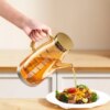 Botella 2 en 1 de Vidrio 1 L con Asa y Pico Antigoteo